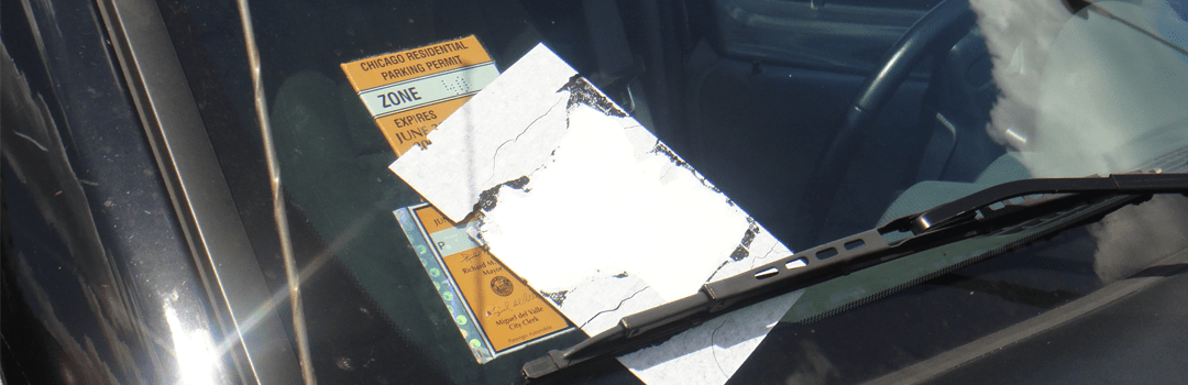 Flyers under windshield wipers